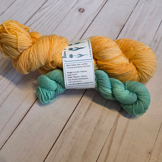 Two Loops Fingering Sock Set speckled orange and mint sock set by Three Tulips Yarn