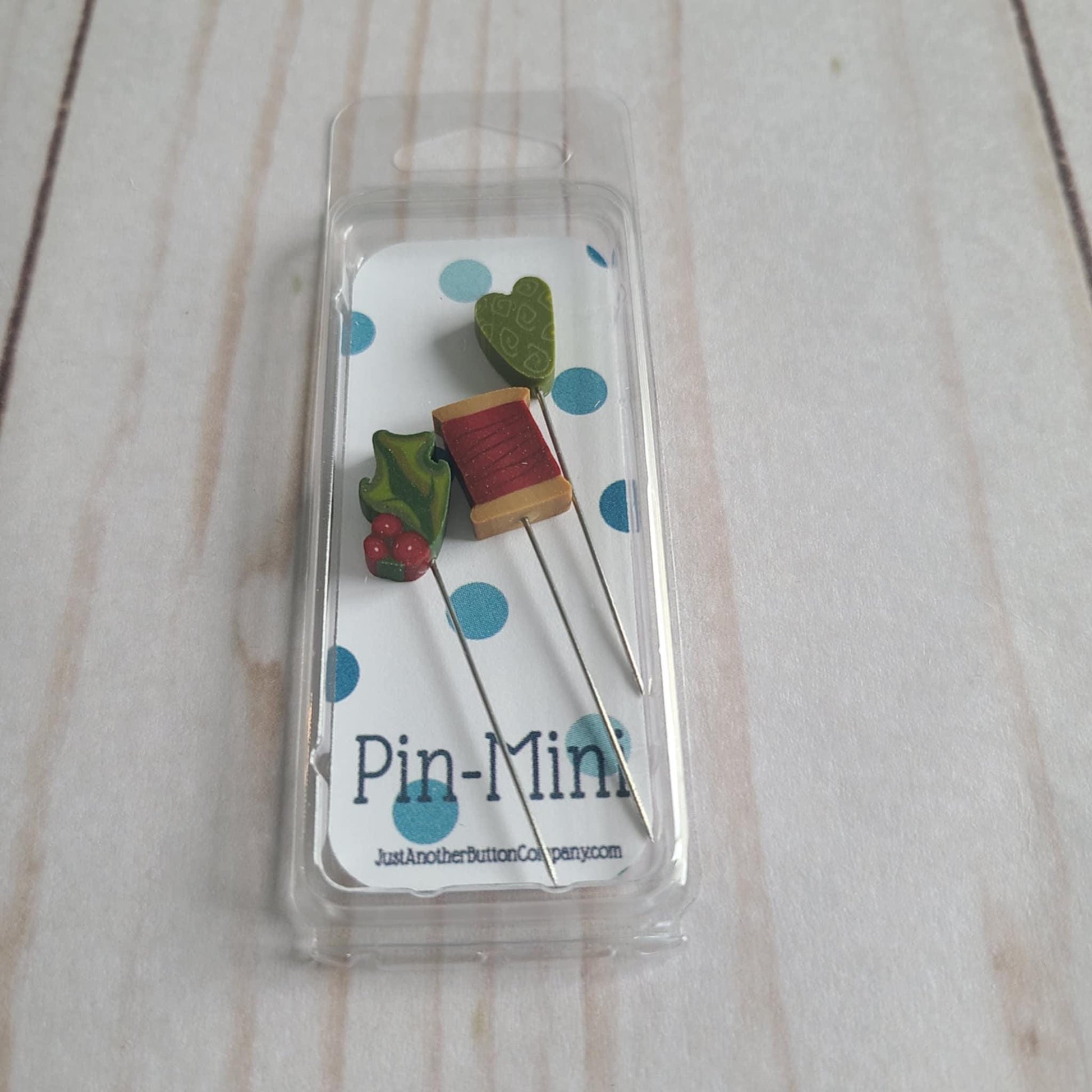 Just Another Button Company Pin-Mini Christmas Stitch thread spool, holly