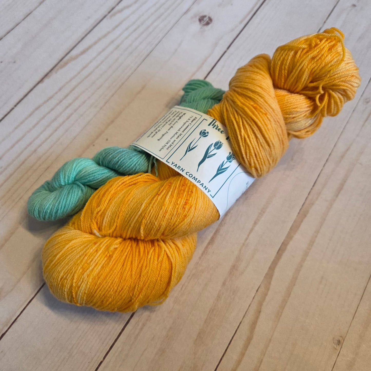 Two Loops Fingering Sock Set speckled orange and mint sock set by Three Tulips Yarn